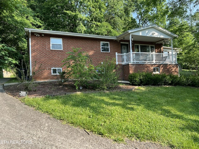 111 Old Evacuation Ln, Oliver Springs, TN 37840 - single story home featuring brick siding, a front yard, and covered porch