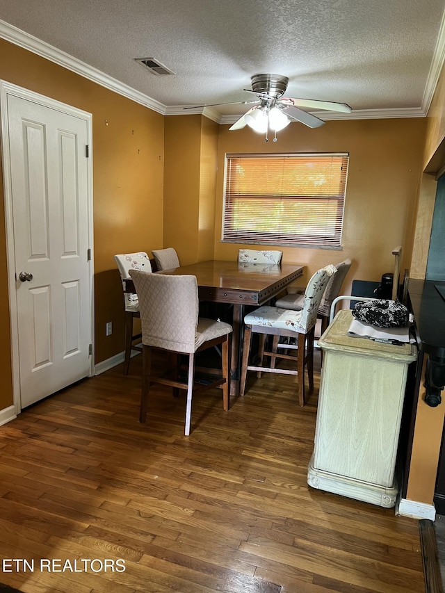 111 Old Evacuation Ln, Oliver Springs, TN 37840 - dining room featuring wood finished floors, ceiling fan, a textured ceiling, and ornamental molding