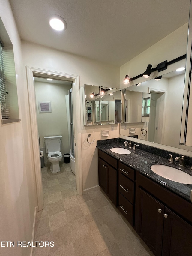 111 Old Evacuation Ln, Oliver Springs, TN 37840 - bathroom with toilet, double vanity, a shower with shower door, and tile patterned floors