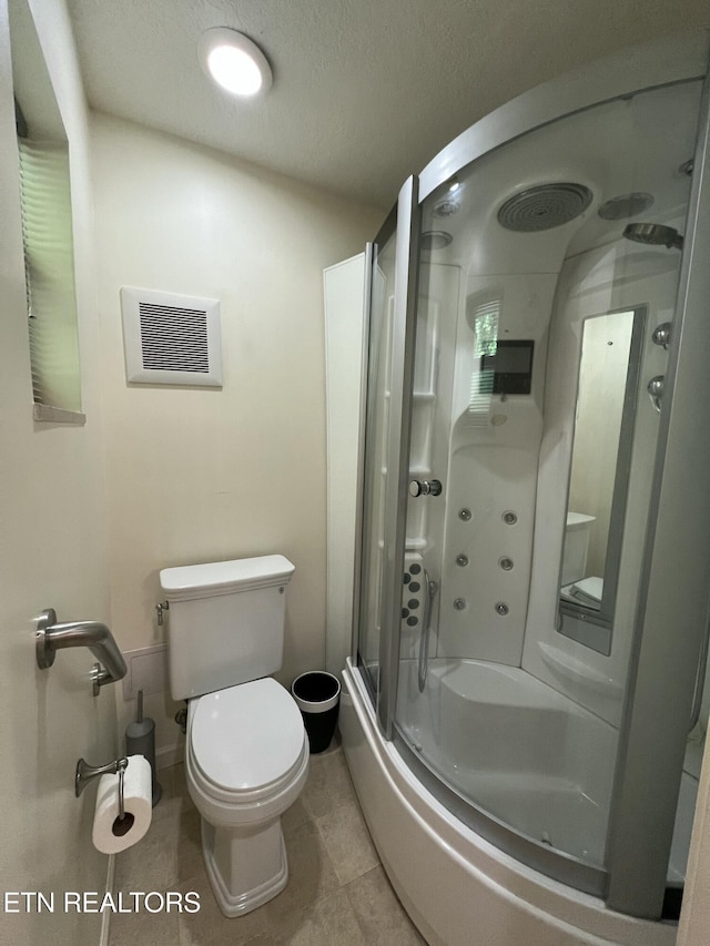 111 Old Evacuation Ln, Oliver Springs, TN 37840 - full bathroom featuring toilet, bath / shower combo with glass door, and tile patterned flooring