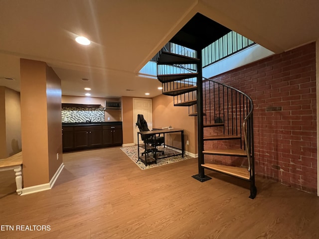 111 Old Evacuation Ln, Oliver Springs, TN 37840 - stairs with wood finished floors, baseboards, brick wall, and recessed lighting