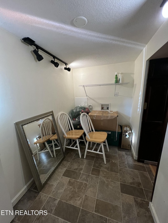 111 Old Evacuation Ln, Oliver Springs, TN 37840 - interior space with a textured ceiling, track lighting, and baseboards