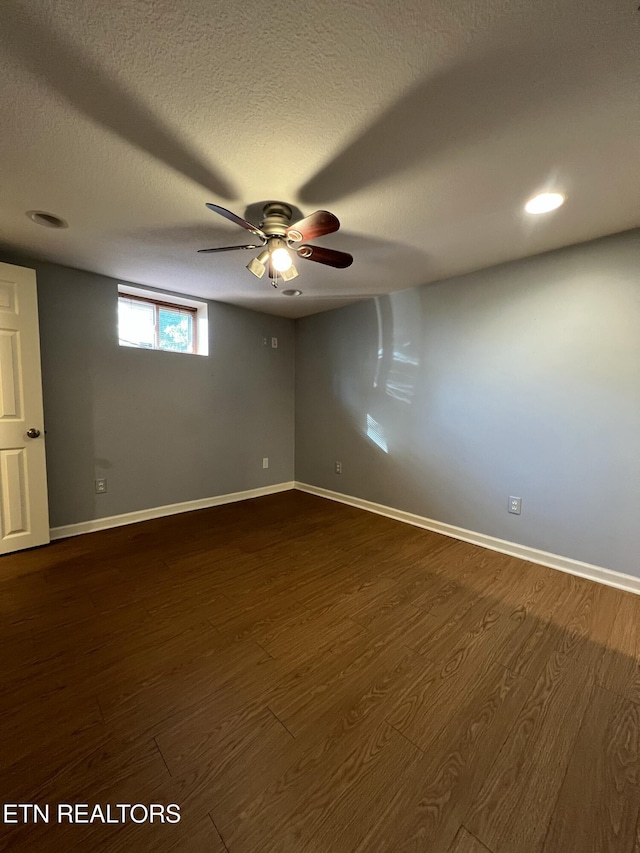 111 Old Evacuation Ln, Oliver Springs, TN 37840 - spare room with dark wood-type flooring, baseboards, ceiling fan, and a textured ceiling