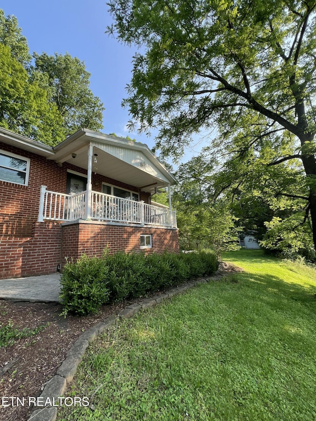 111 Old Evacuation Ln, Oliver Springs, TN 37840 - view of property exterior featuring brick siding and a yard