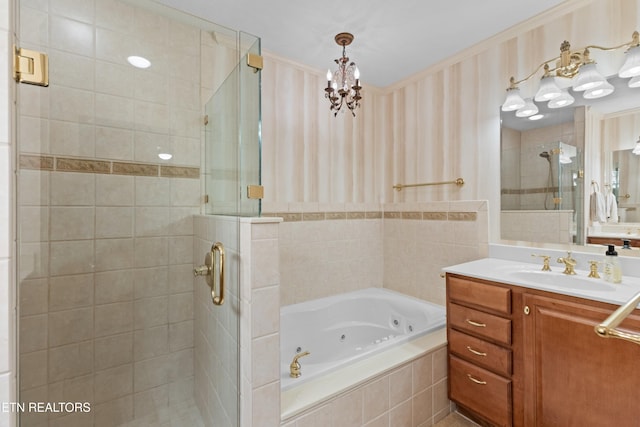 bathroom featuring shower with separate bathtub and vanity