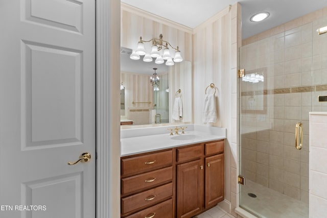 bathroom with vanity and a shower with shower door