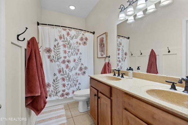 full bathroom with tile patterned flooring, vanity, toilet, and shower / tub combo with curtain