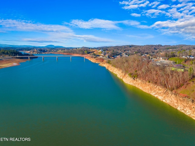 aerial view featuring a water and mountain view