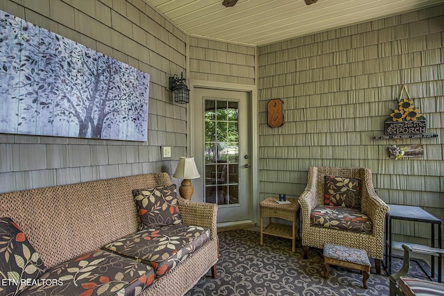 sunroom / solarium with ceiling fan