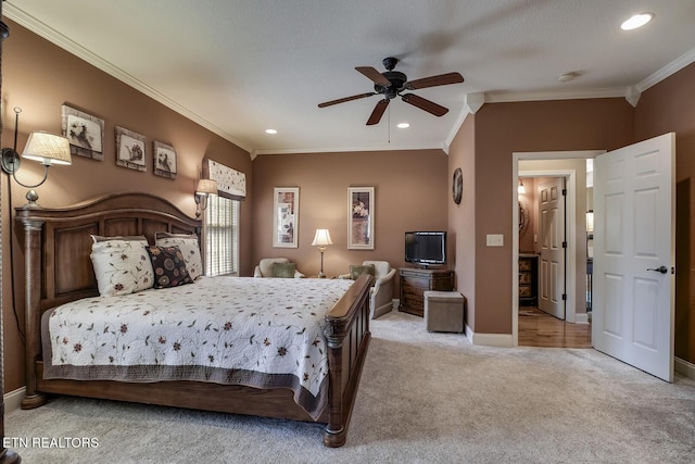 carpeted bedroom featuring crown molding, baseboards, recessed lighting, and a ceiling fan