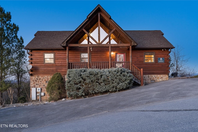 view of log cabin