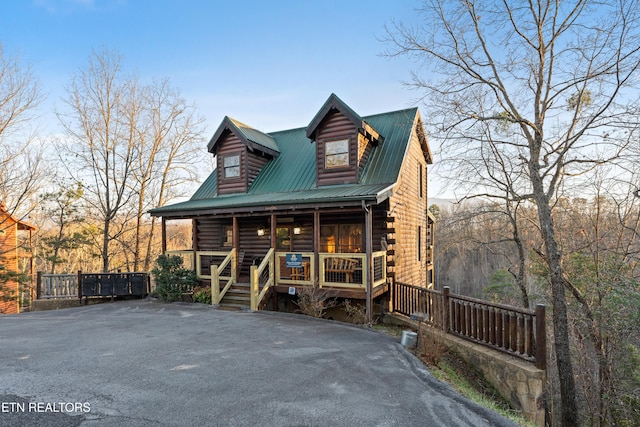 cabin with covered porch