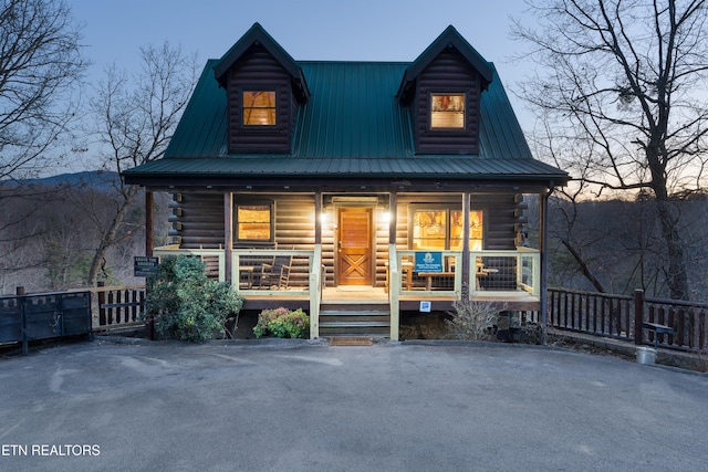 log-style house with a porch