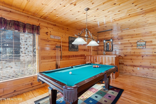 game room featuring billiards, light hardwood / wood-style flooring, wooden ceiling, and wooden walls