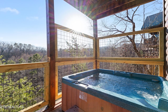 deck with a hot tub