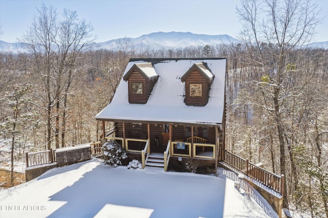 cabin with a mountain view and covered porch