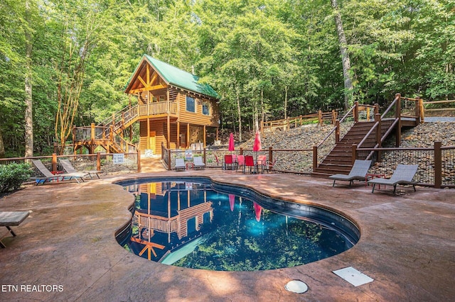 view of pool with a patio area