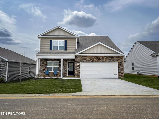 craftsman house with a garage and a front lawn