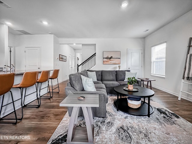 living room with dark wood-type flooring