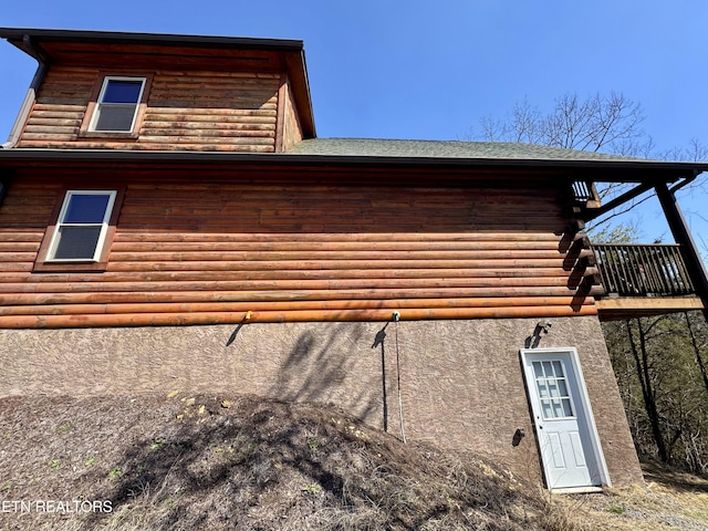 view of side of home featuring stucco siding