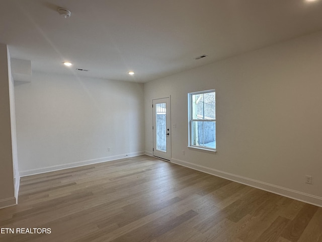 unfurnished room featuring light hardwood / wood-style floors