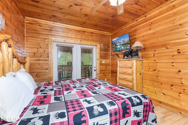 bedroom featuring wood-type flooring, wooden ceiling, and wooden walls