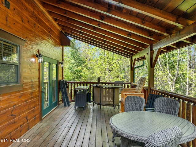 wooden deck featuring french doors