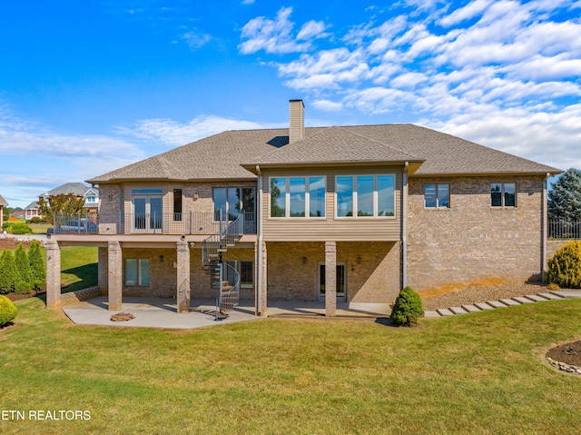 rear view of property with french doors, a patio, and a lawn