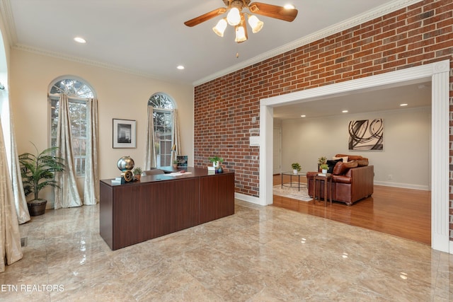 office area featuring crown molding, ceiling fan, and brick wall