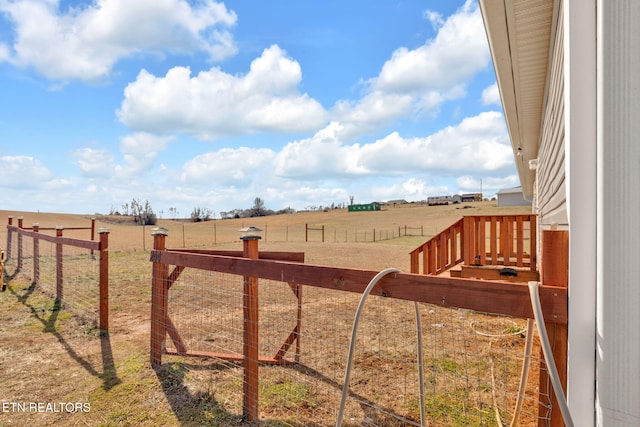 view of yard with a rural view