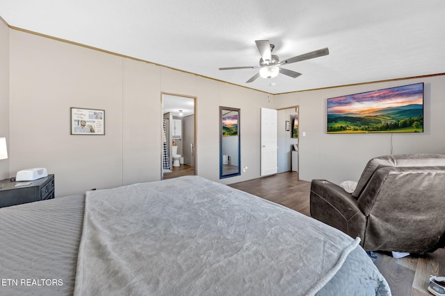 bedroom featuring ceiling fan, crown molding, a textured ceiling, and dark hardwood / wood-style flooring