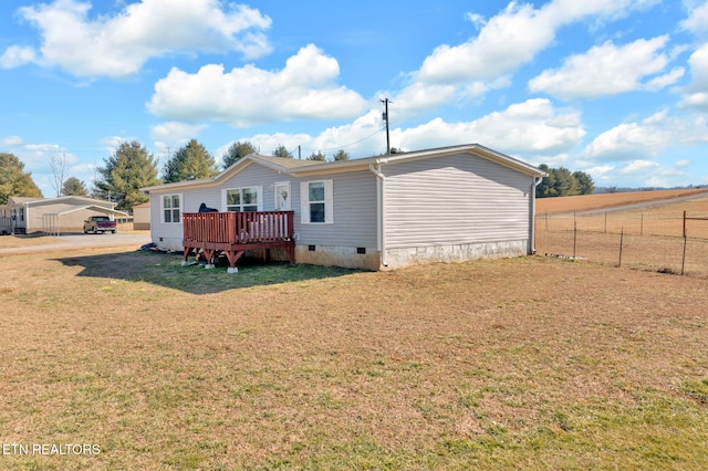 back of house with a yard and a deck