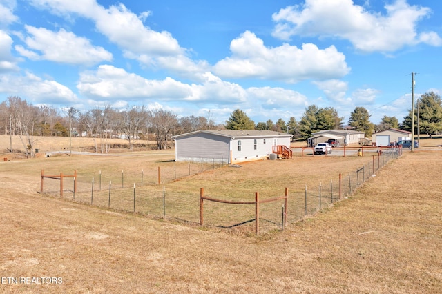 view of yard featuring a rural view