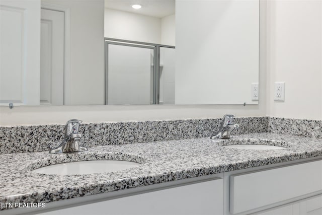 12468 Hatmaker Ln, Knoxville, TN 37932 - bathroom featuring double vanity, a shower stall, and recessed lighting