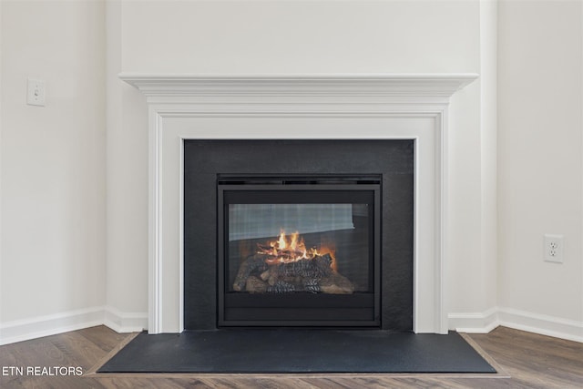 12468 Hatmaker Ln, Knoxville, TN 37932 - detailed view of a fireplace with flush hearth, wood finished floors, and baseboards