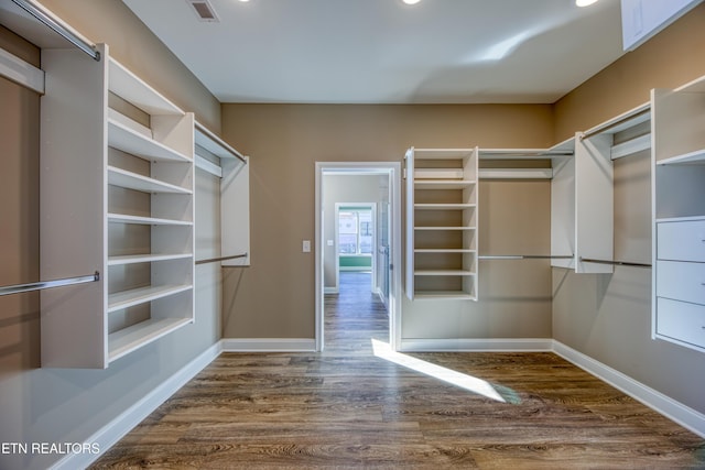 walk in closet featuring dark hardwood / wood-style flooring