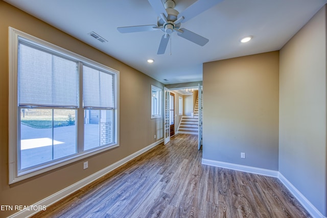 unfurnished room with ceiling fan and light wood-type flooring