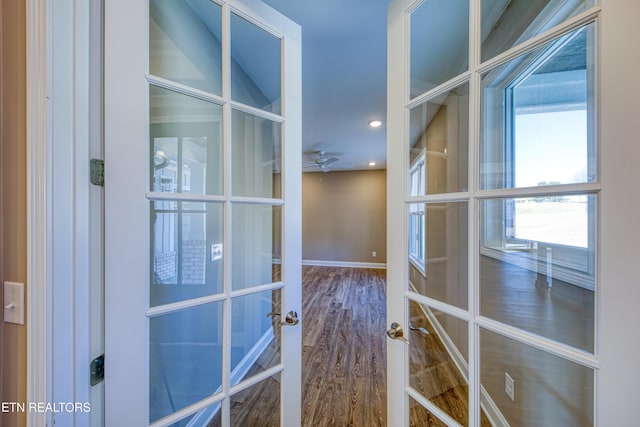 interior space with french doors and hardwood / wood-style flooring