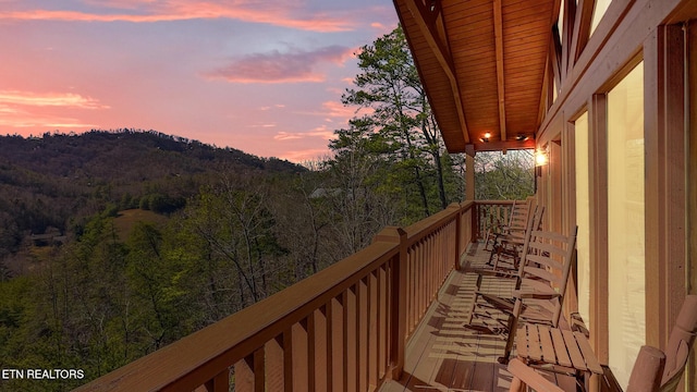 view of balcony at dusk