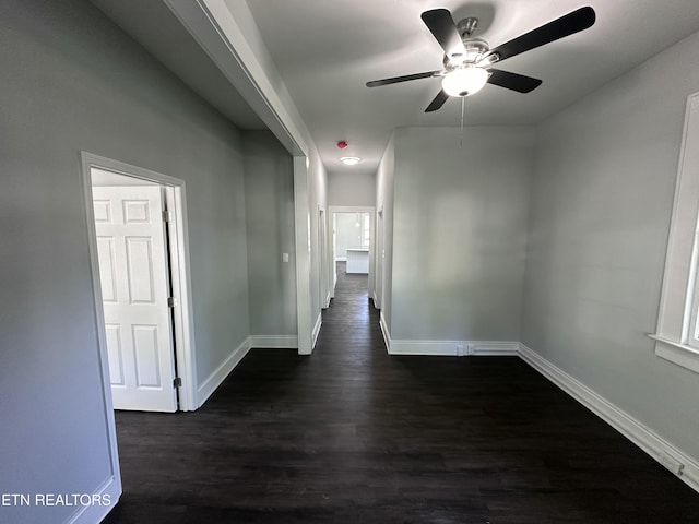 hallway featuring dark hardwood / wood-style flooring