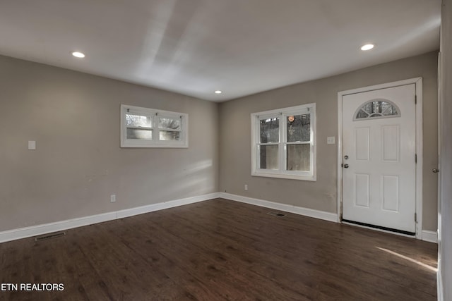 foyer entrance with dark hardwood / wood-style floors