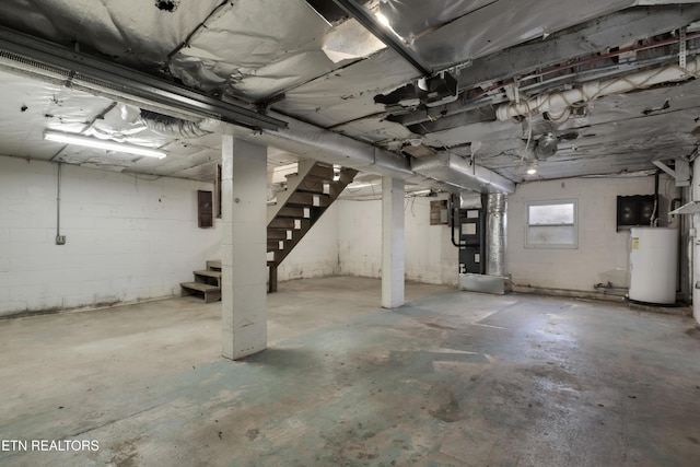 basement with water heater, heating unit, and electric panel