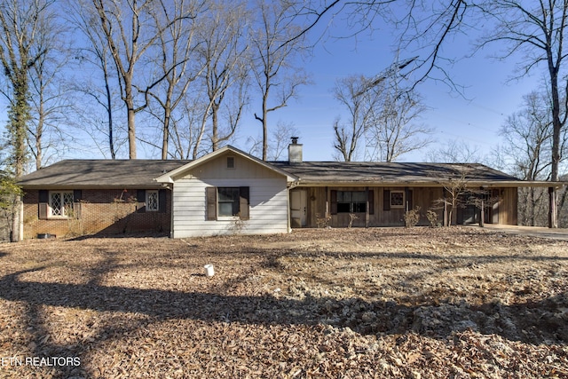 ranch-style house with a carport