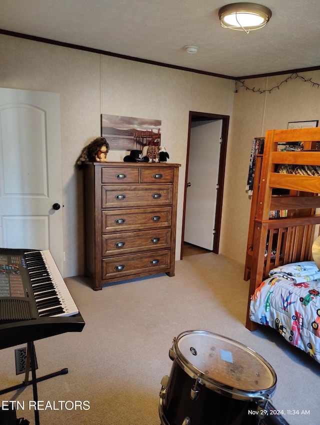 bedroom featuring ornamental molding and light carpet