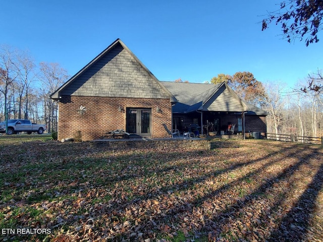 back of house with a patio area and french doors