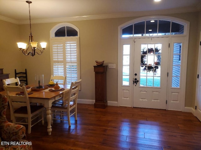 dining space with crown molding, a notable chandelier, and dark hardwood / wood-style flooring