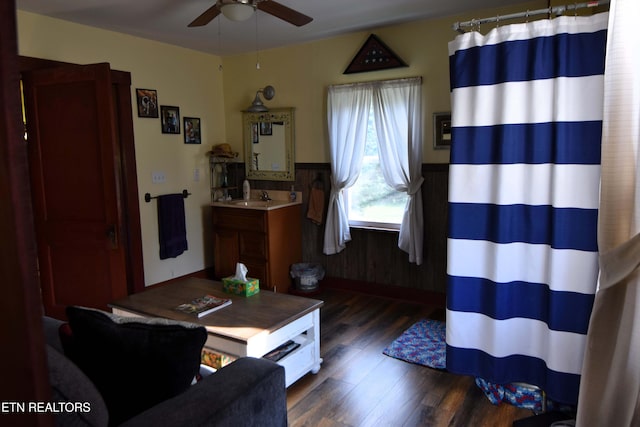 living room featuring ceiling fan, dark hardwood / wood-style flooring, and sink