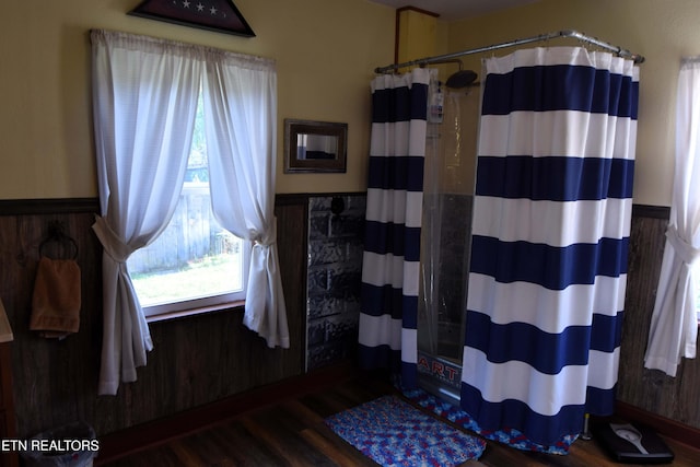 bathroom featuring a shower with curtain and wood-type flooring