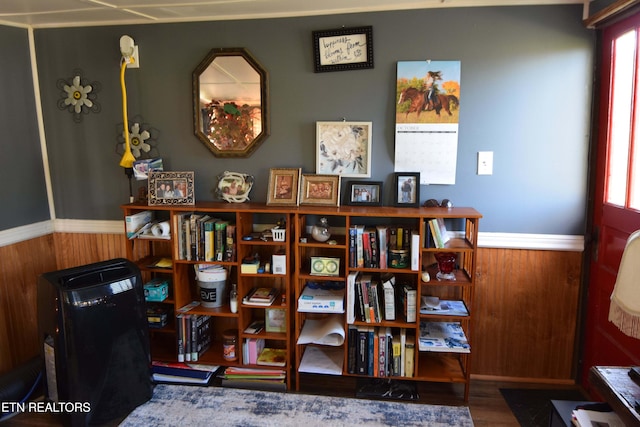 office area featuring wood-type flooring and wood walls