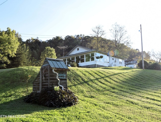 view of yard with a sunroom